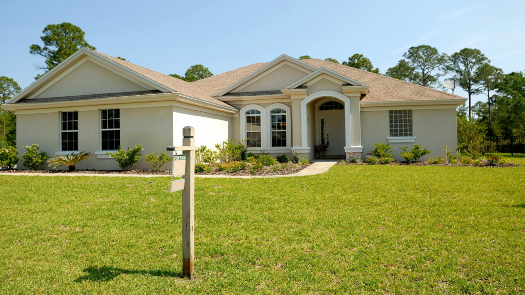 White and Brown Concrete Bungalow Under Clear Blue Sky